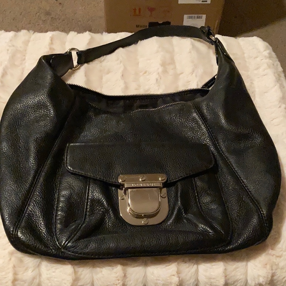 A black Michael Kors shoulder bag